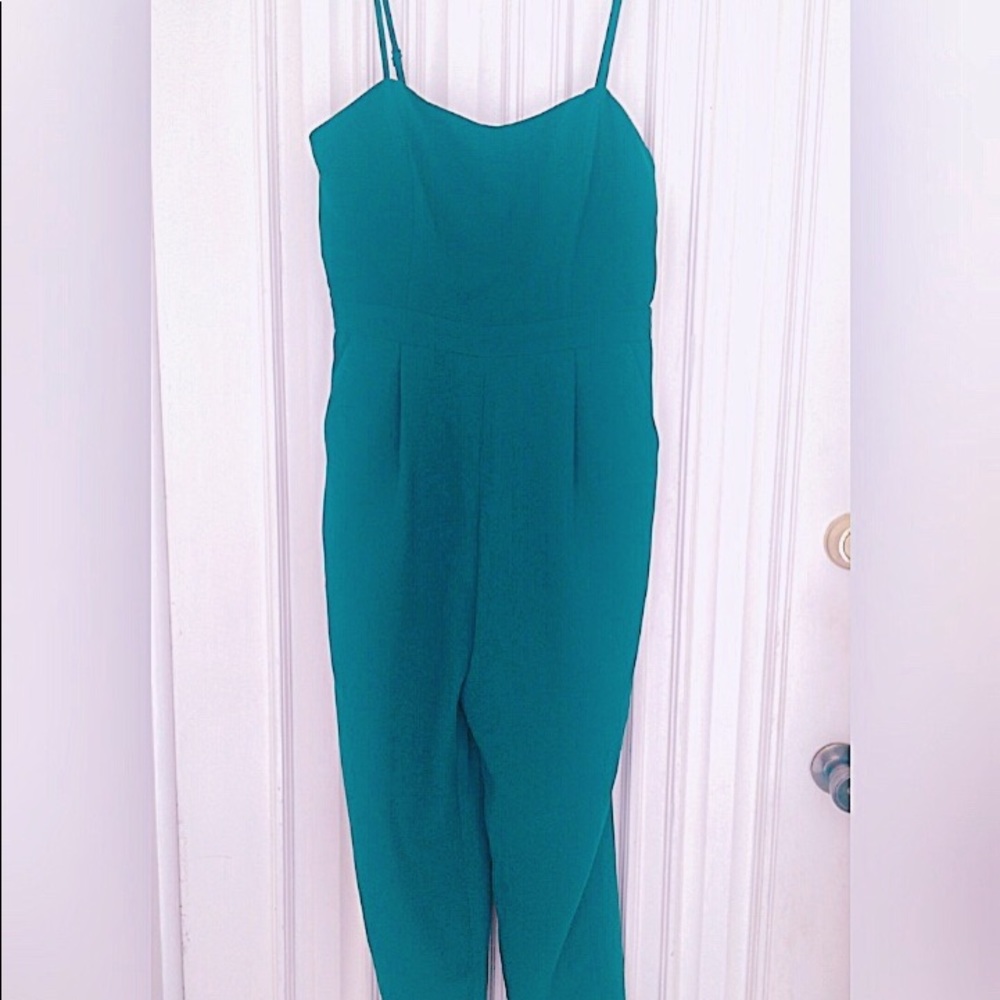 Dark green full body jumpsuit with pockets.